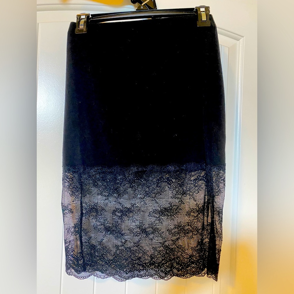 Black pencil skirt with lace finish.